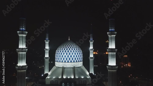 Masjid Sultan Salahuddin Abdul Aziz Shah - The Blue Mosque. Biggest Mosque in Southeast Asia, Shah Alam, Malaysia. (aerial photography) photo