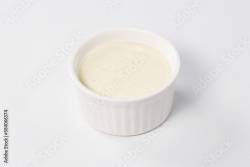 white sauce, mayonnaise on a white background