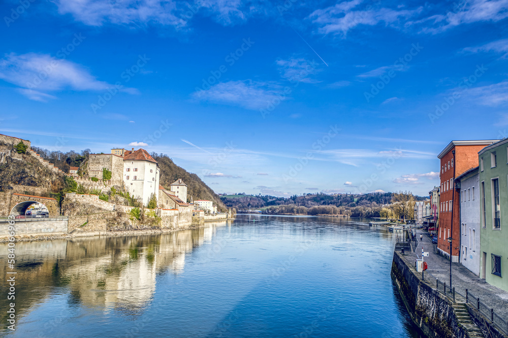 High dynamic range cityscape view of Passau city with view at the river Danube and Veste Niederhaus in early spring in march
