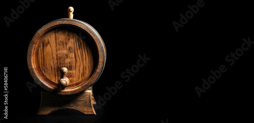 Wooden barrel on dark background with space for text
