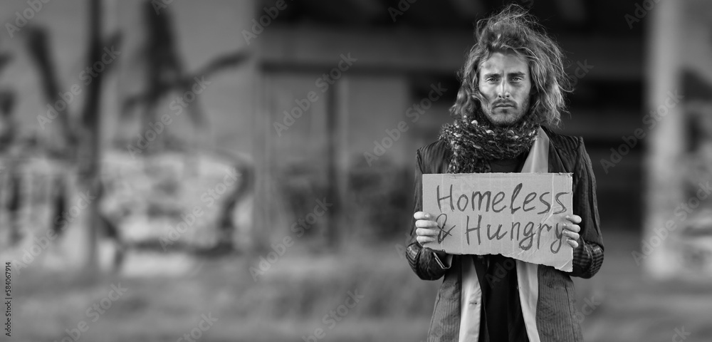 Black and white portrait of poor homeless man outdoors