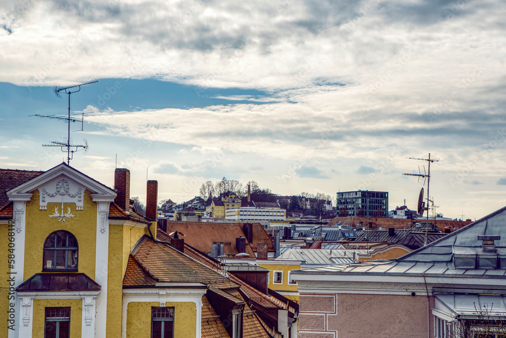Urban city roof top view in front of blue sky with clouds Urban city roof top view in front of blue sky with clouds
