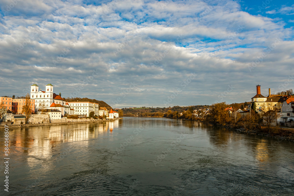High dynamic range cityscape view of Passau city with view at the river inn in late afternoon with evening sunlight in March