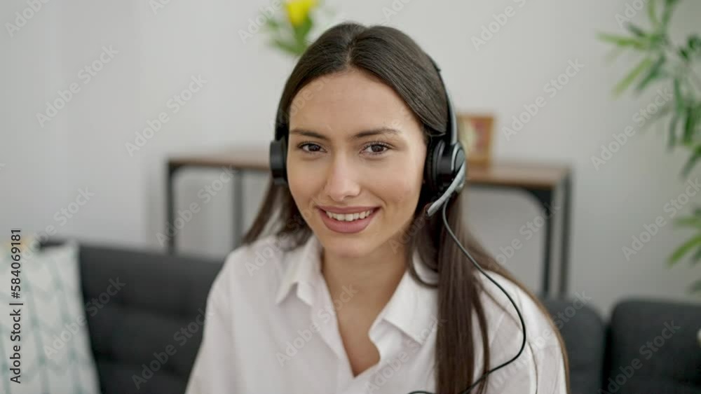Young beautiful hispanic woman call center agent working at home Young beautiful hispanic woman call center agent working at home