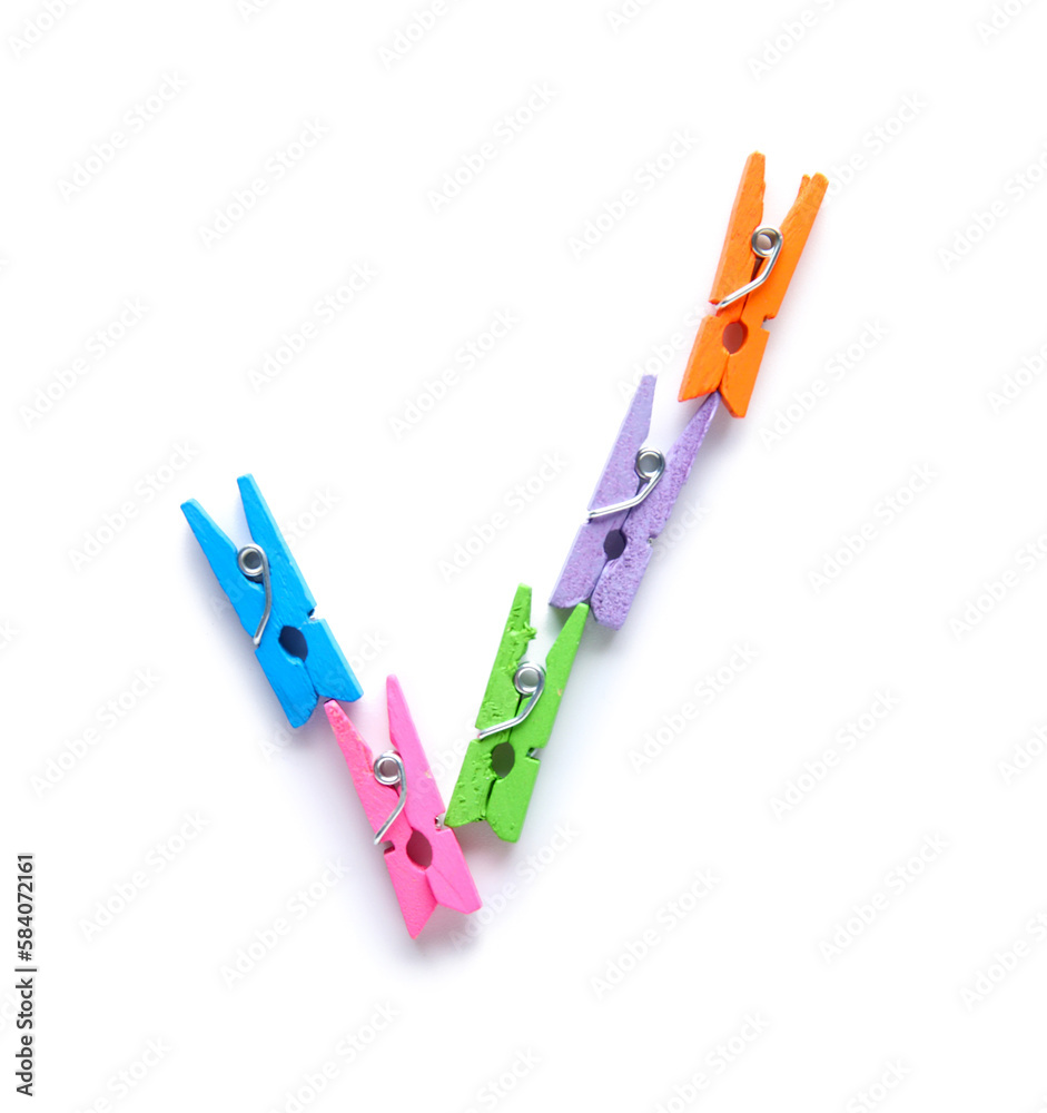Check mark made of clothespins on white background Check mark made of clothespins on white background