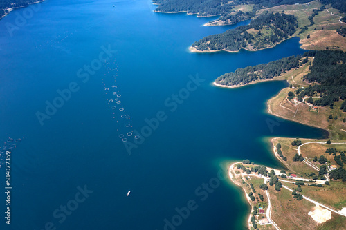 Aerial view of the amazing lake coast with calm water.