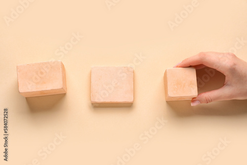 Woman with wooden cubes on ...