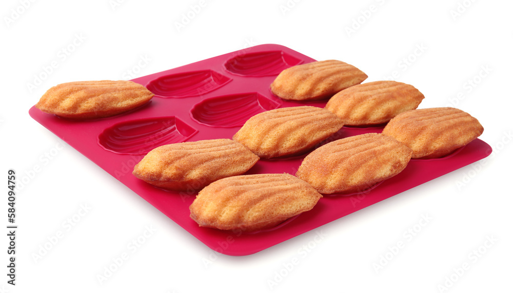 Fototapeta premium Many tasty madeleine cookies in baking mold isolated on white