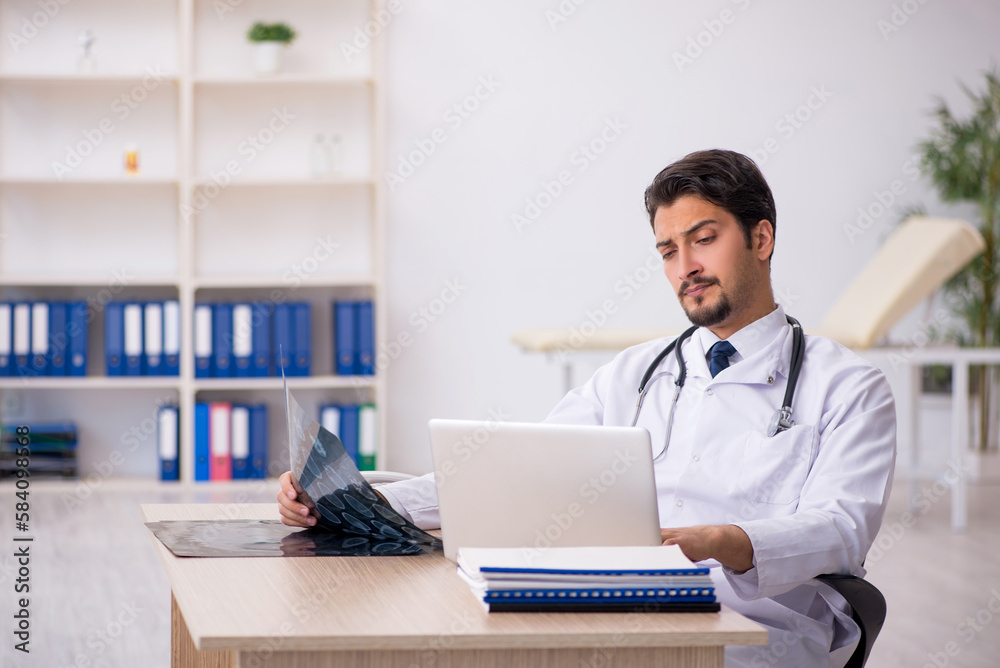 Young male doctor radiologist working in the clinic Young male doctor radiologist working in the clinic
