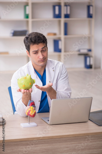 Young male doctor in planning retirement concept