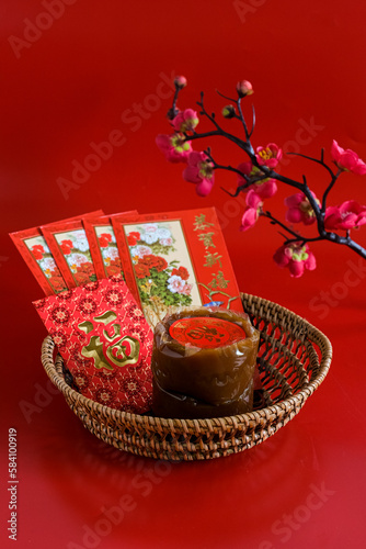 nian gao or chinese new year cake, dodol cina, kue bakul or kue keranjang in red bacground. CNY concept