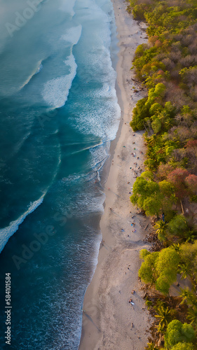 Aerial photography in Costa Rica, beach forest and ocean waves during sunset colors, amazing trip travel