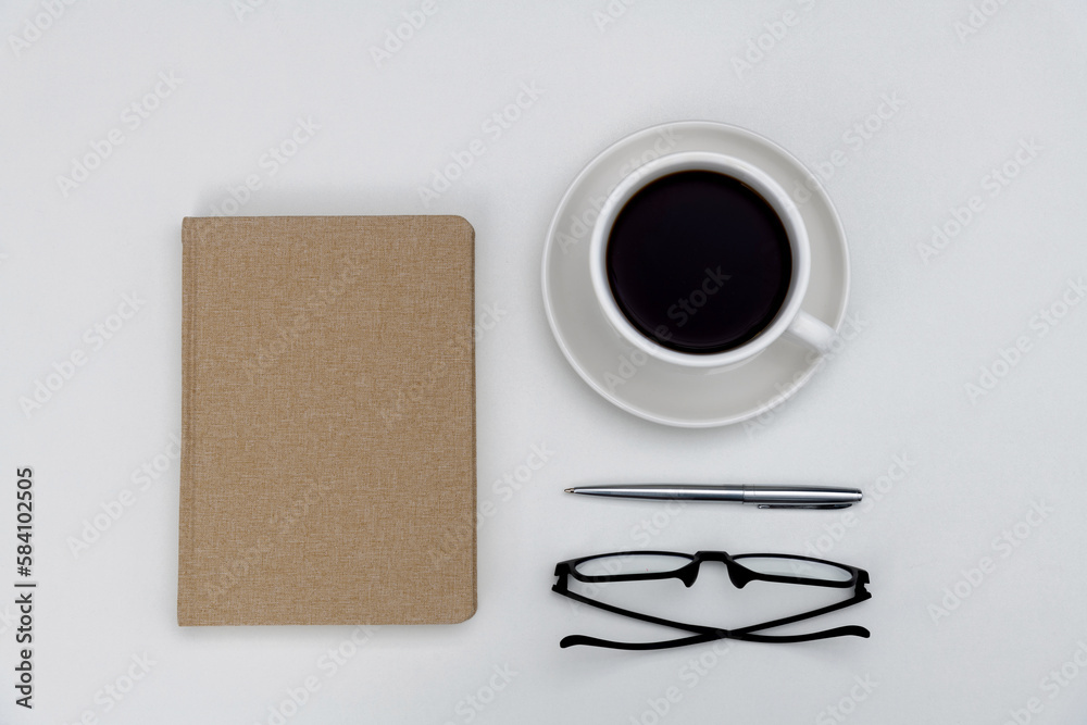 Book with coffee cup and reading glasses Book with coffee cup and reading glasses