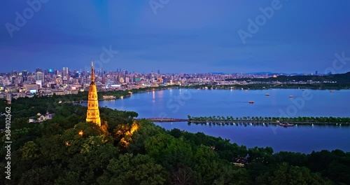 Aerial view of Hangzhou skyline and ancient Baochu Tower scenery at night, China. photo