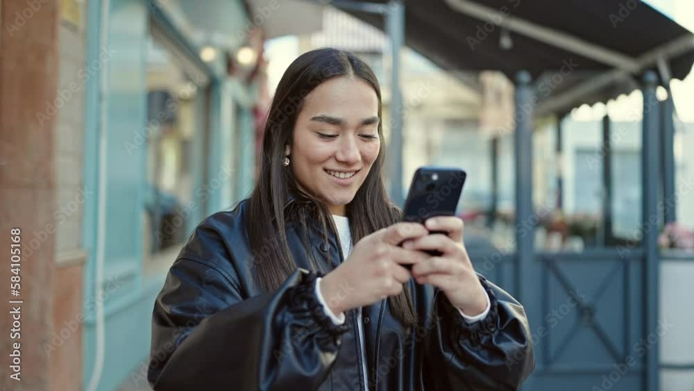 Young beautiful hispanic woman smiling confident recording video by smartphone at coffee shop terrace Young beautiful hispanic woman smiling confident recording video by smartphone at coffee shop terrace