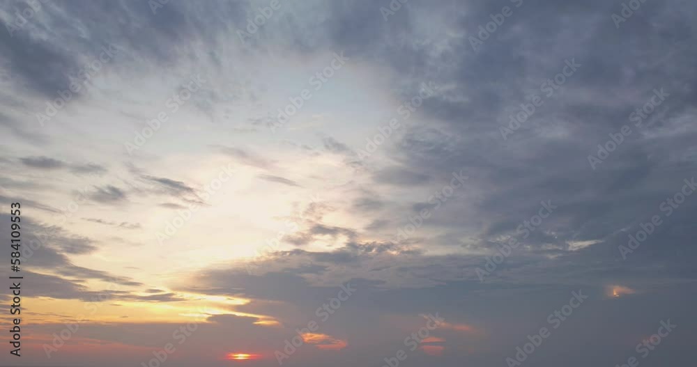 Time lapse clouds at sunrise over the city, Dramatic shining yellow in the sky orange purple cloud sunrise sky. Time lapse clouds at sunrise over the city, Dramatic shining yellow in the sky orange purple cloud sunrise sky.