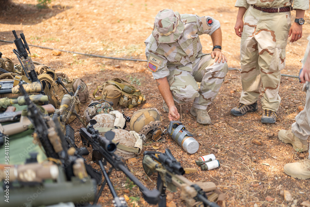 Team of U.S. Army marine corps soldier military war with gun weapon participating and preparing to attack the enemy in Thailand during exercise Cobra Gold training in battle. Combat force.