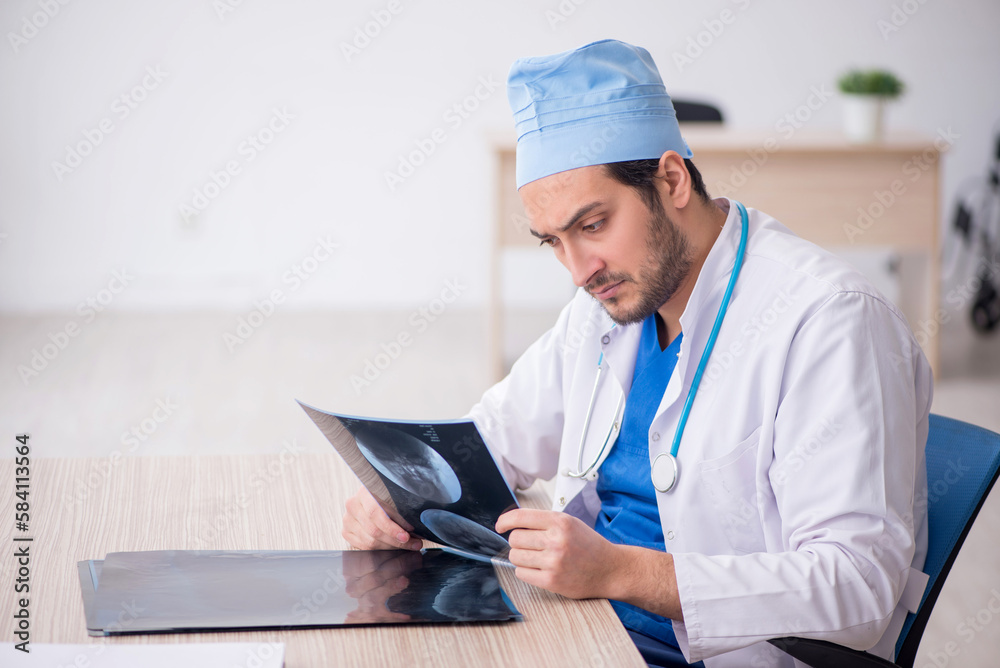 Young male doctor radiologist working in the clinic Young male doctor radiologist working in the clinic
