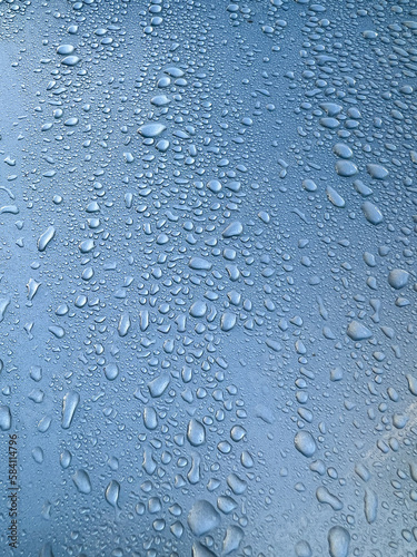 close up drops of water on a car