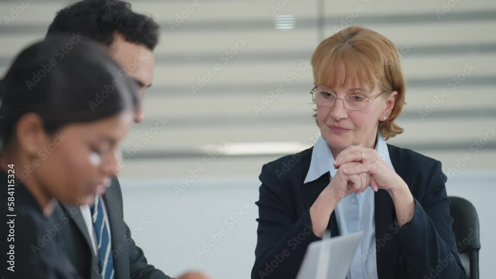 Colleagues and woman manager talking and disscussed strategy of company growth with laptop at boardroom meeting Colleagues and woman manager talking and disscussed strategy of company growth with laptop at boardroom meeting