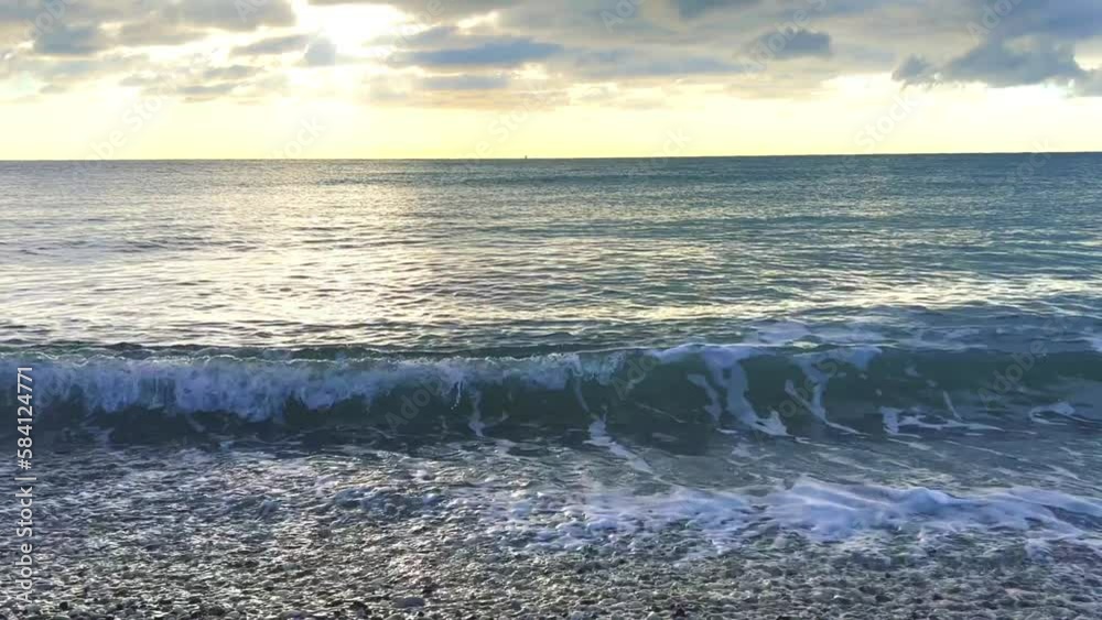 Powerful sea waves are crashing on the Black Sea coast. Waves splash on the beach with pebbles during a storm. Storm at sea. Panoramic view of the Black Sea. Russia. Sunset on the beach. 4K Powerful sea waves are crashing on the Black Sea coast. Waves splash on the beach with pebbles during a storm. Storm at sea. Panoramic view of the Black Sea. Russia. Sunset on the beach. 4K