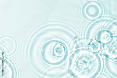 Abstract water, cosmetic background with rings, water surface. Spa concept background. Splash cosmetic moisturizer water micellar toner or emulsion