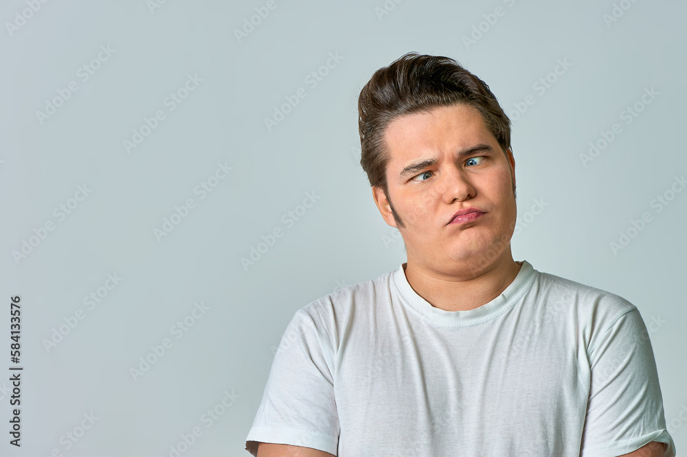 the man on the gray background brought his eyes together the man on the gray background brought his eyes together