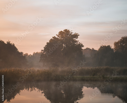Fototapeta Naklejka Na Ścianę i Meble -  Sunrise over the river. Concept of early waking and new beginning