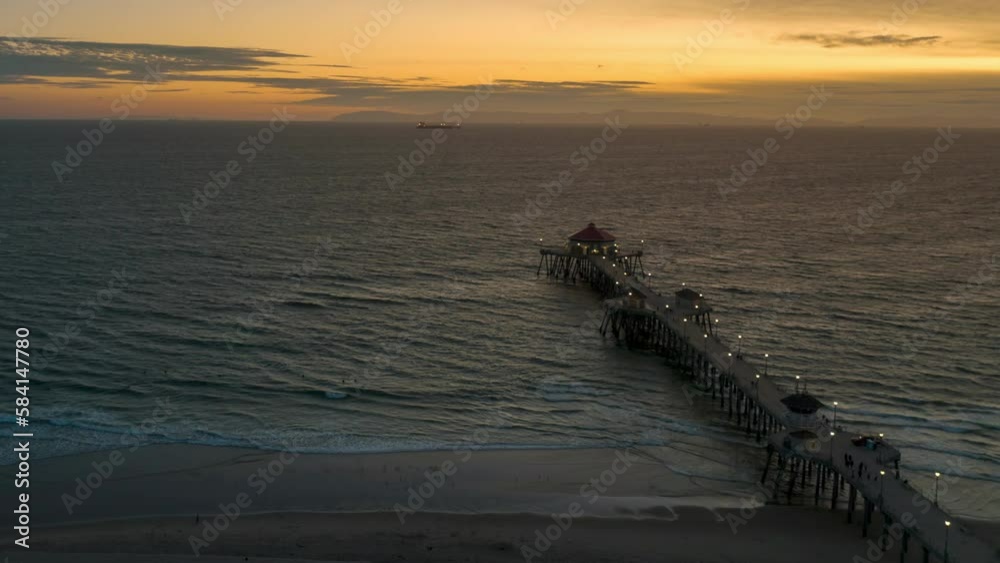 Aerial Time Lapse of Iconic Huntington Beach Pier at Sunset with Waves Crashing Aerial Time Lapse of Iconic Huntington Beach Pier at Sunset with Waves Crashing