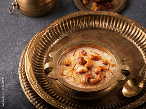 Famous Indian dessert kheer or semiya payasam topped with dry fruits and nuts photo