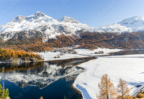 Panorama view of the Swiss Alps town Silvaplana between Lake Champfer and Lake Silvaplana in Grisons with snow mountain Corvatsch at the background photo