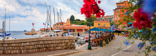 Colorful restaurants by Mediterranean Sea, Villefranche sur Mer, South of France photo