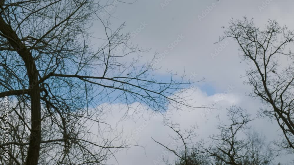 A helicopter passes by above at high altitude in a cloudy day. A helicopter passes by above at high altitude in a cloudy day.