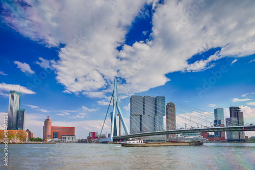 Picturesque Cityscape View of Rotterdam Harbour and Port in Front of Erasmusbrug (Swan Bridge) on Background. © danmorgan12