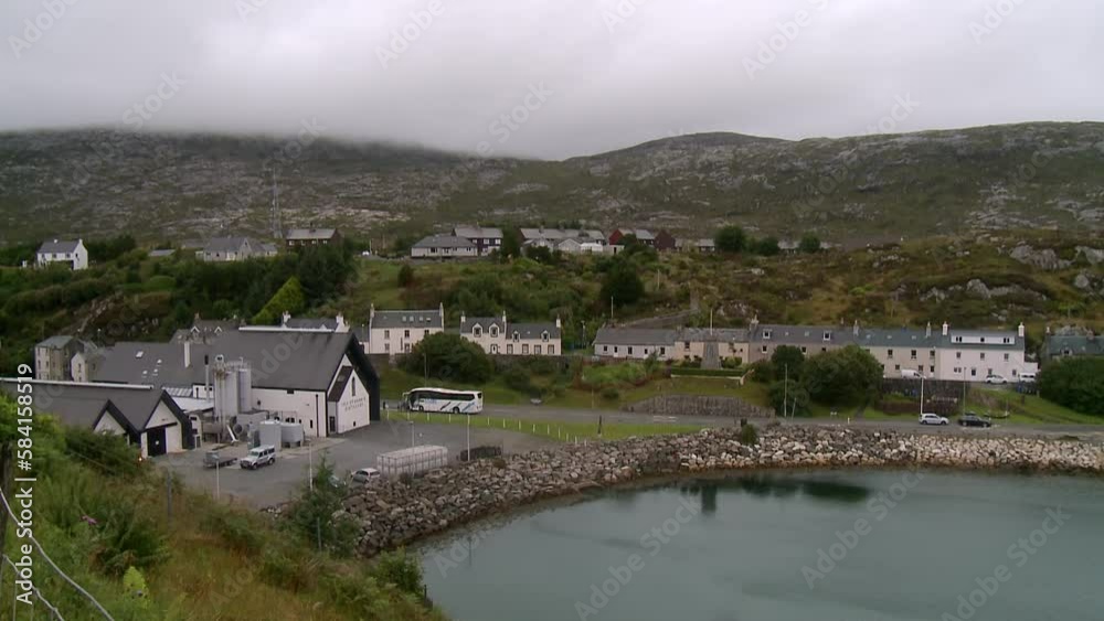 A shot of the village of Tarbert with the whiskey distillery in the foreground. Filmed on the Isle of Harris, part of the Outer Hebrides of Scotland.