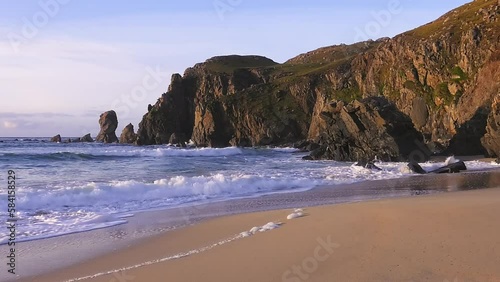 Golden hour footage of the waves and the headland around Dalmore beach near Carloway. Filmed on the Isle of Lewis, part of the Outer Hebrides of Scotland. photo