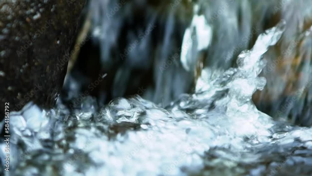 Slowmo shot of water in a river. Filmed on the Isle of Lewis, part of the Outer Hebrides of Scotland. Slowmo shot of water in a river. Filmed on the Isle of Lewis, part of the Outer Hebrides of Scotland.