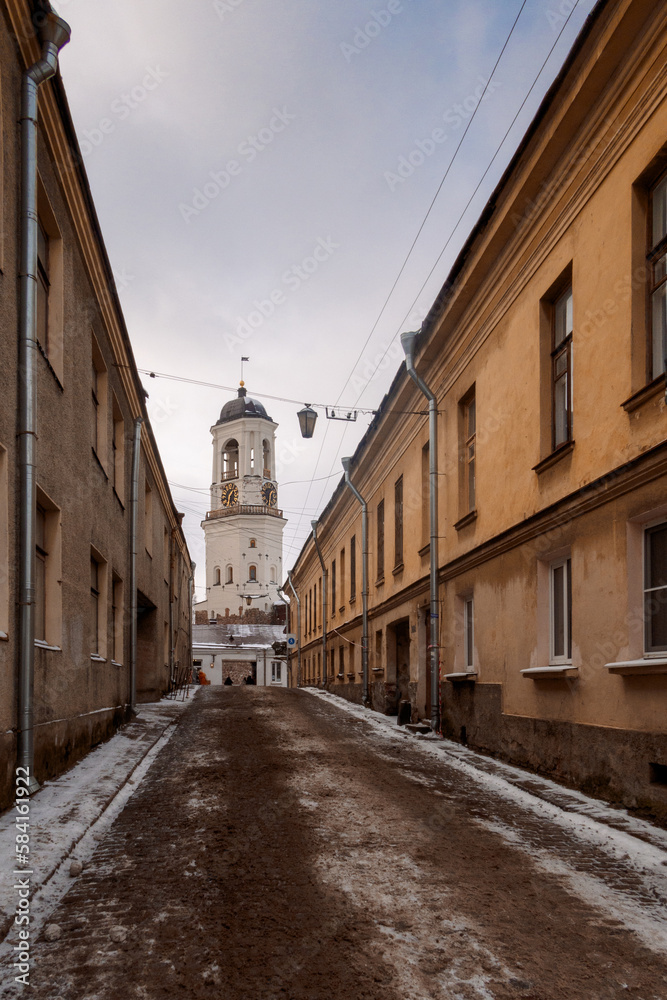 Street of old town with view of old Clock Tower. Belfry of Vyborg Cathedral, Vyborg, Russia. High quality photo