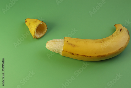 Circumcision concept, banana with skin cut off healthy operation for males. photo