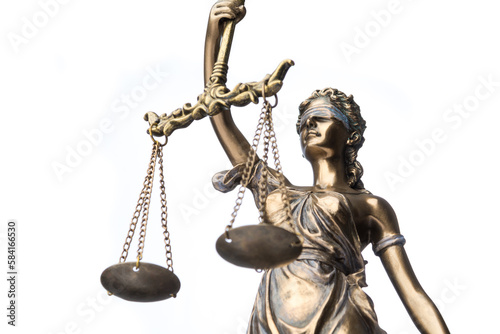 The statue of justice Themis or Justitia isolated on white background, low angle view, close up 