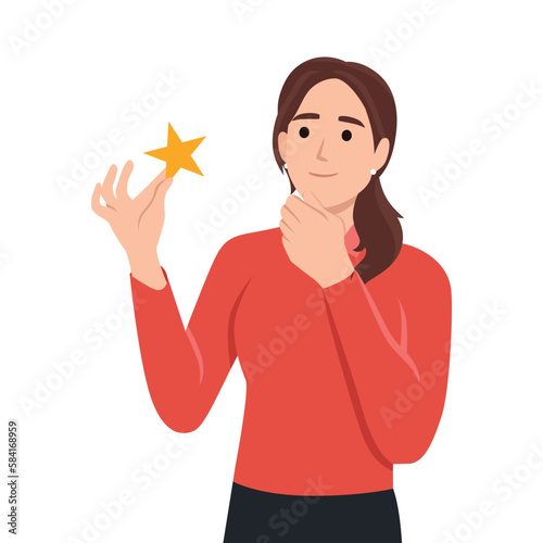 Satisfaction level. Young woman holding star. Customer review rating and client feedback concept. Smiling cute brunette girl