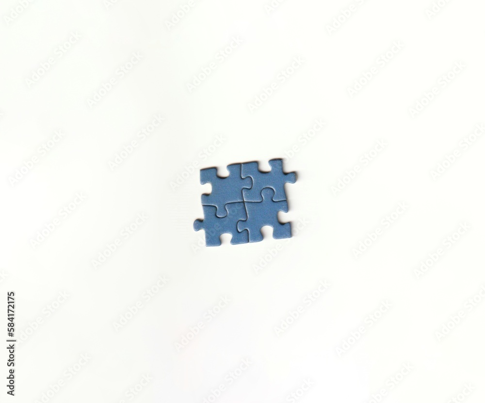 Pieces of a jigsaw puzzle that have been put together on a white background depicting teamwork and problem solving puzzle day Pieces of a jigsaw puzzle that have been put together on a white background depicting teamwork and problem solving puzzle day