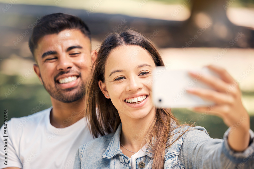 Outdoor, couple and smile with a selfie for love, care and happiness together in summer. Young man and woman at nature park for a profile picture on a happy and romantic date or vacation to relax Outdoor, couple and smile with a selfie for love, care and happiness together in summer. Young man and woman at nature park for a profile picture on a happy and romantic date or vacation to relax