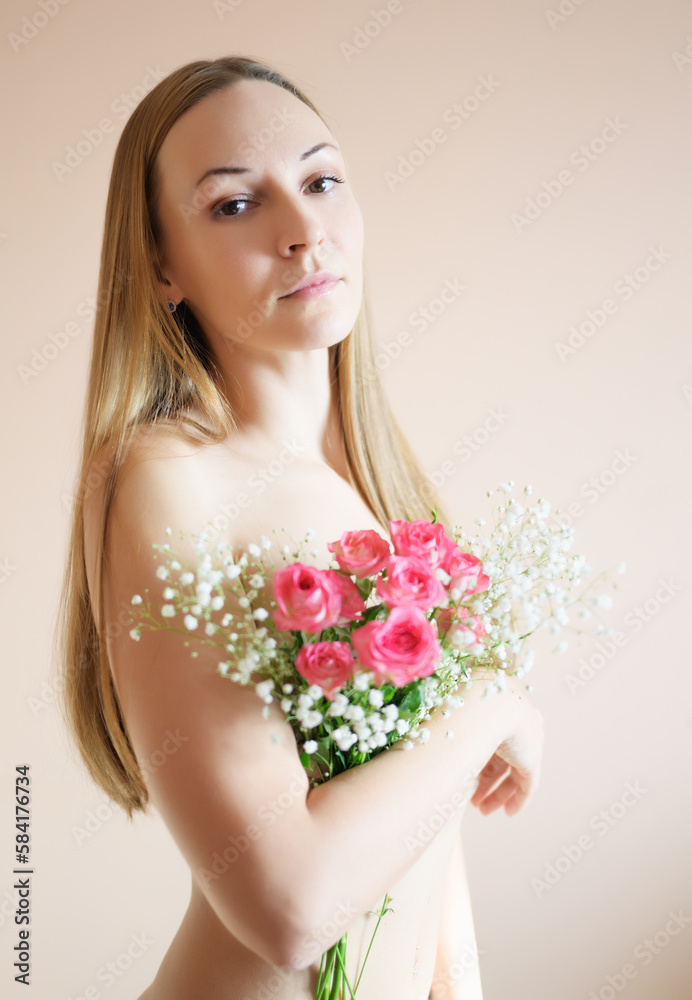 Young woman with bouquet of flowers.