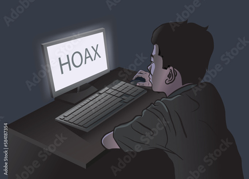 young man browsing fake news 'hoax' in the dark