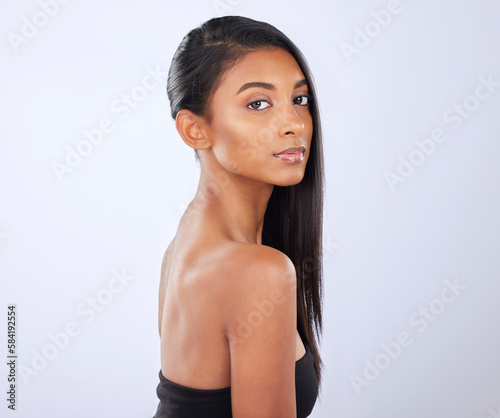 Indian woman, hair care or mockup in studio portrait for strong, healthy natural shine or wellness. Face of glowing young girl model, beauty spa or self care cosmetics in grooming on white background