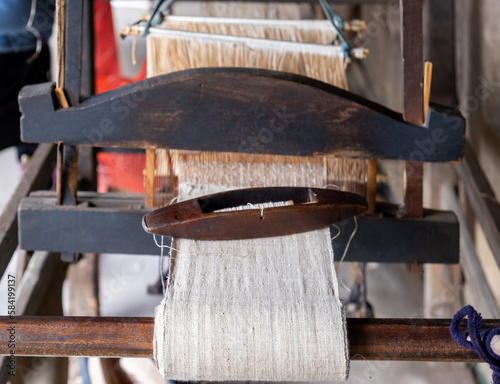 Ancient hand-weaving wooden loom, close-up photo, Hmong village. Vietnam