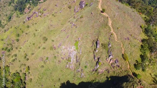 Aerial view of the mountain green hills from above. Calm beautiful video on the background for tourism, design and advertising.