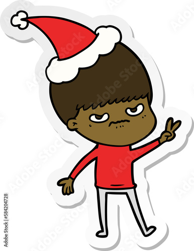 annoyed sticker cartoon of a boy wearing santa hat photo