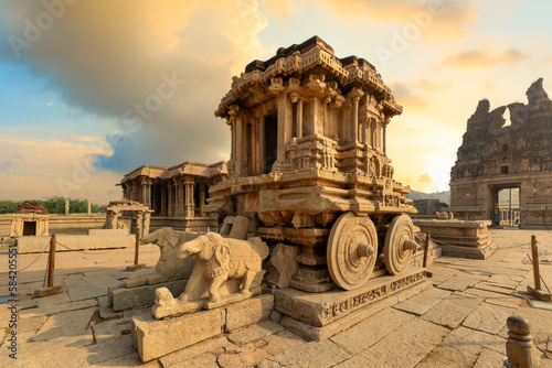 The stone chariot with ancient medieval architecture at the Vijaya Vittala temple at Hampi Karnataka, India at sunset